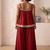 Red palazzo set with mirror-work detailing.