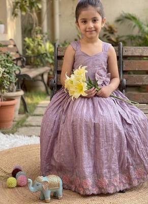 New trendy girls elegant white crinkled ethnic gown with pink lotus border and stylish waist bow 3