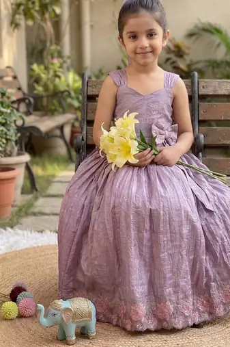New trendy girls elegant white crinkled ethnic gown with pink lotus border and stylish waist bow
