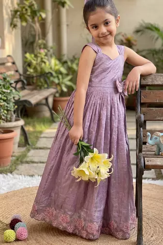 New trendy girls elegant white crinkled ethnic gown with pink lotus border and stylish waist bow
