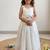 New latest girls sage green crinkled silk festive gown with handcrafted bow and lotus cutwork border