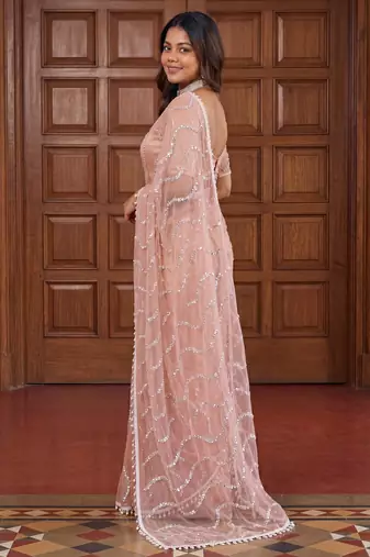 peach embroidered net saree