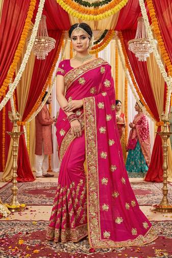 Slub chiffon wedding wear saree in rani pink with embroidery work & crystal stone work