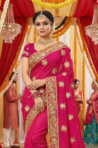 Slub chiffon wedding wear saree in rani pink with embroidery work & crystal stone work