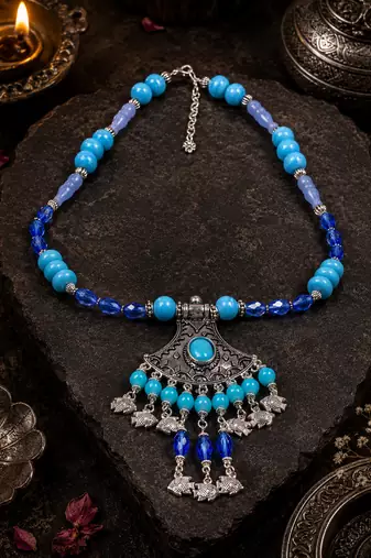 Traditional beaded necklace with ornamental pendant