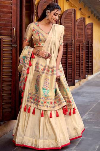 Glamorous Cream Zari Weaving Silk Marriage Wear Lehenga Choli