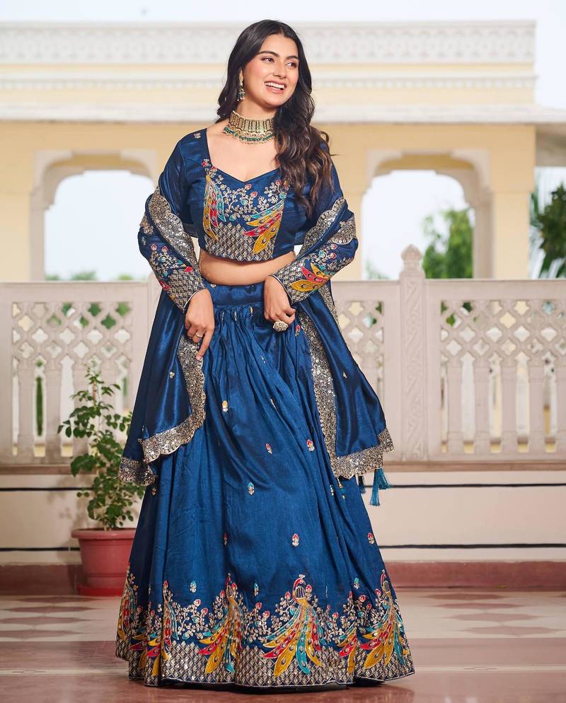 Blue Vichitra silk lehenga choli set featuring heavy peacock embroidery and sequins work