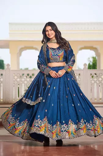 Blue Vichitra silk lehenga choli set featuring heavy peacock embroidery and sequins work