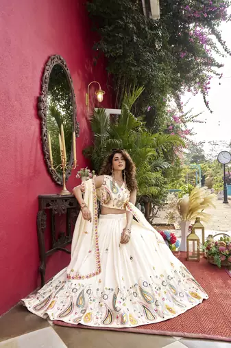 Off White Pure Vichitra silk lehenga choli featuring heavy embroidered paisley motifs, sequence work