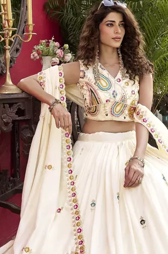 Off White Pure Vichitra silk lehenga choli featuring heavy embroidered paisley motifs, sequence work