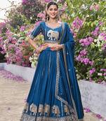 Blue Vichitra silk lehenga choli set featuring intricate elephant motif embroidery and sequin work