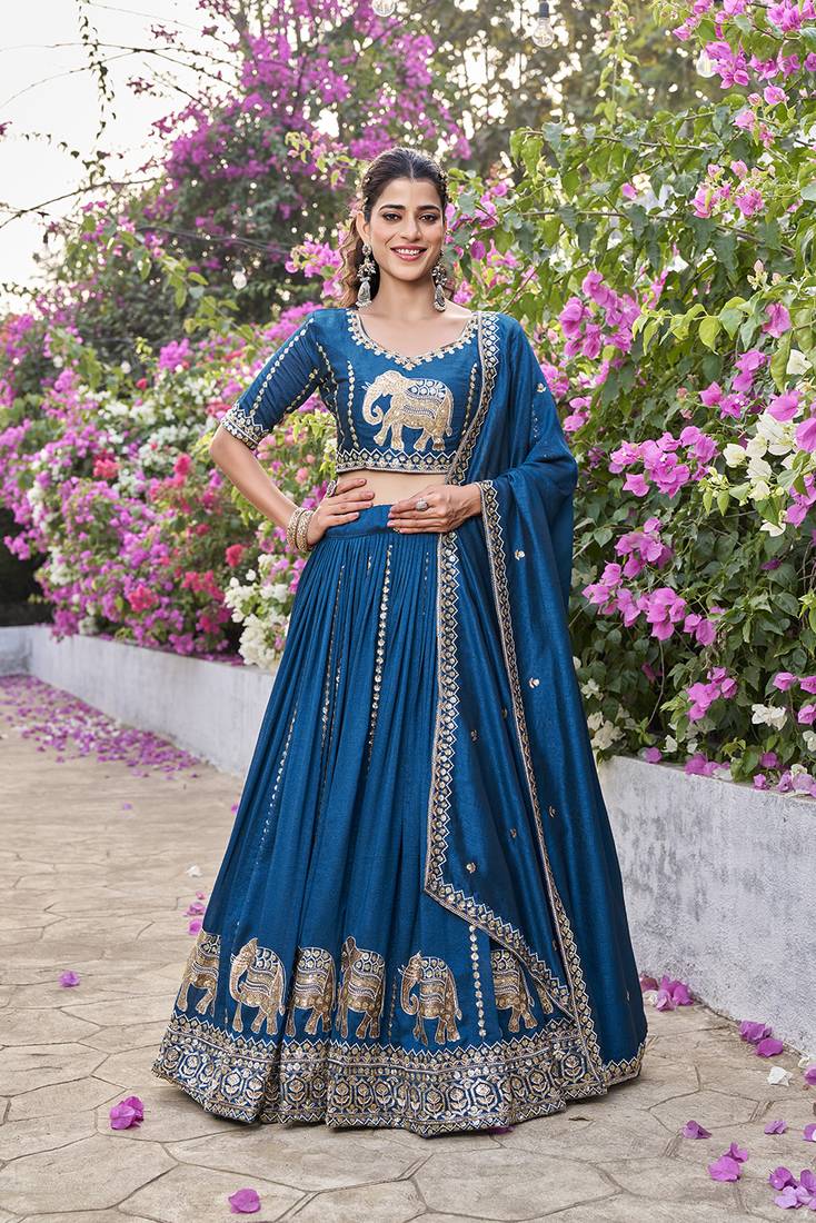 Blue Vichitra silk lehenga choli set featuring intricate elephant motif embroidery and sequin work