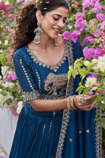 Blue Vichitra silk lehenga choli set featuring intricate elephant motif embroidery and sequin work