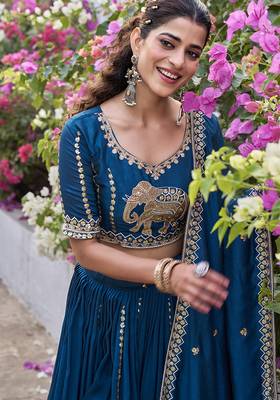 Blue Vichitra silk lehenga choli set featuring intricate elephant motif embroidery and sequin work 4