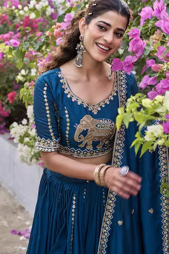 Blue Vichitra silk lehenga choli set featuring intricate elephant motif embroidery and sequin work