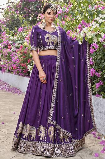 Wine Vichitra silk lehenga choli set featuring intricate elephant motif embroidery and sequin work