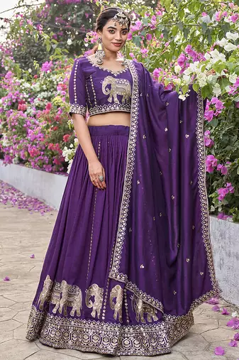 Wine Vichitra silk lehenga choli set featuring intricate elephant motif embroidery and sequin work