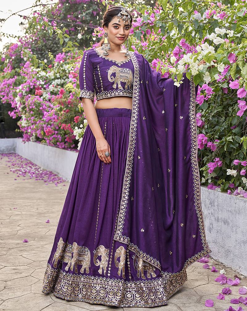 Wine Vichitra silk lehenga choli set featuring intricate elephant motif embroidery and sequin work