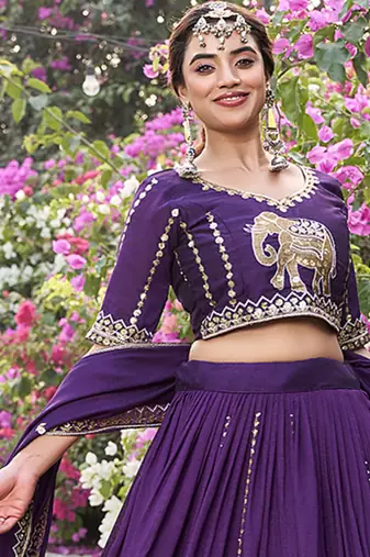 Wine Vichitra silk lehenga choli set featuring intricate elephant motif embroidery and sequin work