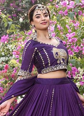 Wine Vichitra silk lehenga choli set featuring intricate elephant motif embroidery and sequin work 3