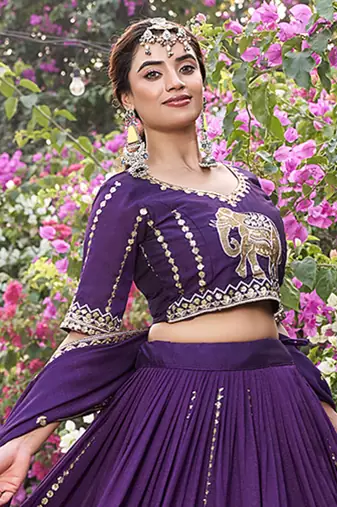 Wine Vichitra silk lehenga choli set featuring intricate elephant motif embroidery and sequin work
