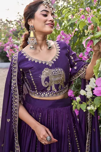 Wine Vichitra silk lehenga choli set featuring intricate elephant motif embroidery and sequin work