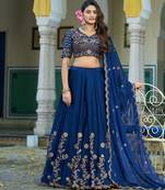 Blue Vichitra silk lehenga choli set featuring intricate sequins and thread embroidery