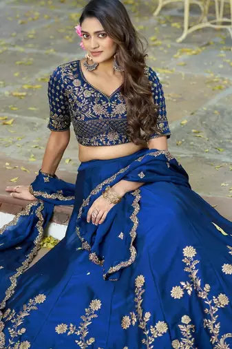 Blue Vichitra silk lehenga choli set featuring intricate sequins and thread embroidery