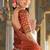 Rust orange Vichitra silk lehenga choli set featuring intricate sequins and thread embroidery