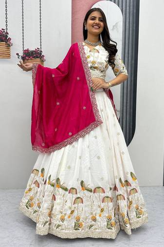 White Vichitra silk lehenga choli set featuring intricate sequins and thread embroidery