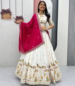 White Vichitra silk lehenga choli set featuring intricate sequins and thread embroidery