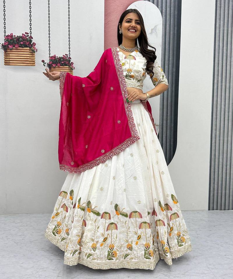 White Vichitra silk lehenga choli set featuring intricate sequins and thread embroidery