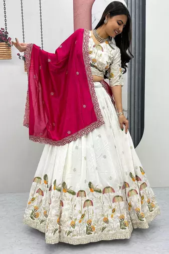 White Vichitra silk lehenga choli set featuring intricate sequins and thread embroidery