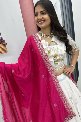 White Vichitra silk lehenga choli set featuring intricate sequins and thread embroidery