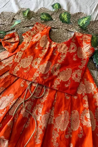 Orange banarasi silk kids lehenga choli set with zari jacquard work for girls
