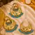 Gold tone earrings & tikka