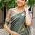 Olive green printed linen blend casual saree with kalamkari floral pallu & unstitched blouse piece