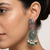 Oxidized silver-tone lotus motif jhumki necklace set with emerald-green accents