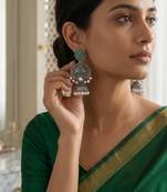 Gold plated-tone lotus motif jhumki necklace set with emerald-green accents