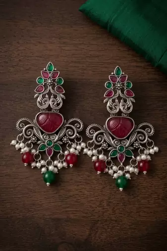 Oxidized silver-tone lotus motif jhumki necklace set with blue accents