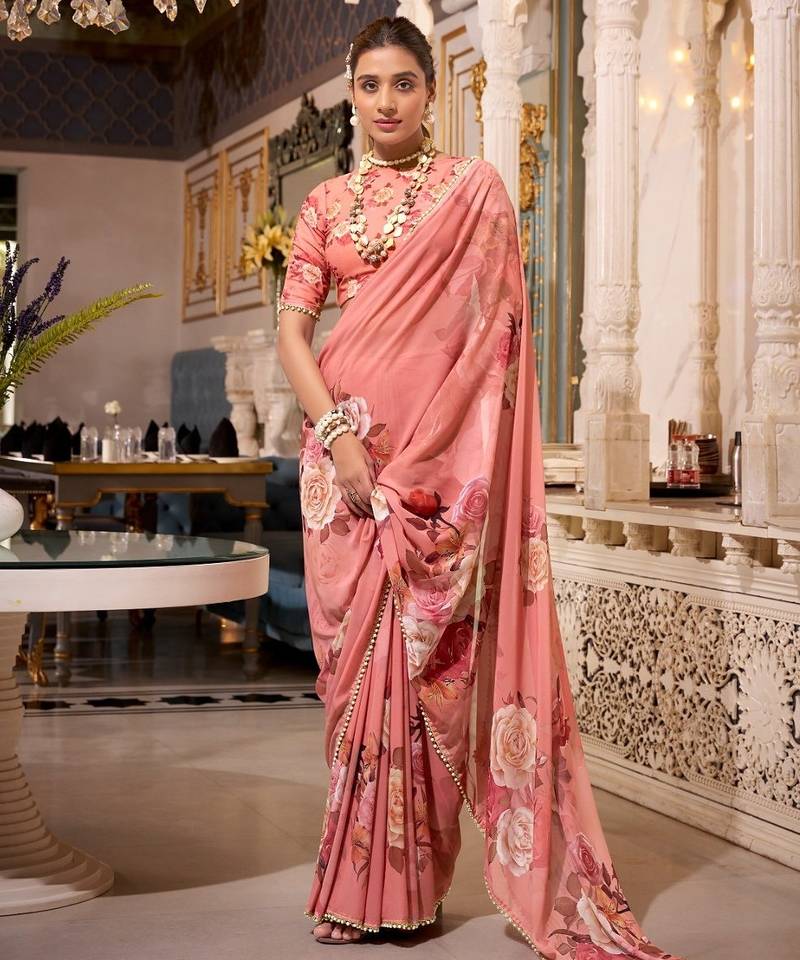 Orange georgette smart floral printed saree with pearl lace border