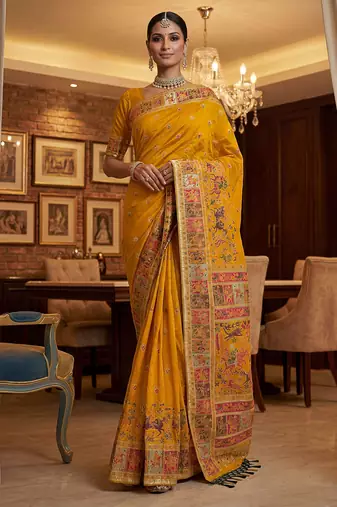 Yellow virana silk blend heavy woven saree with elegant swarovski work