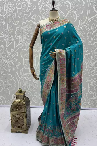 Teal blue virana silk blend heavy woven saree with elegant swarovski work