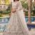 Charming Cream Embroidered Net Engagement Wear Lehenga Choli