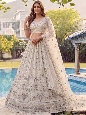 Charming Cream Embroidered Net Engagement Wear Lehenga Choli 2