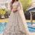 Charming Cream Embroidered Net Engagement Wear Lehenga Choli