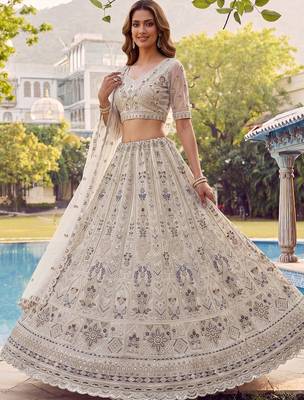 Charming Cream Embroidered Net Engagement Wear Lehenga Choli 3