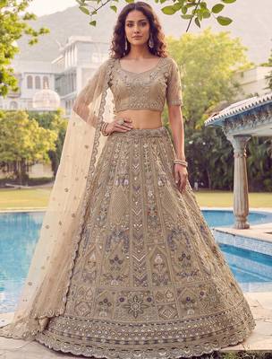 Shiny Beige Embroidered Net Reception Wear Lehenga Choli With Dupatta 1