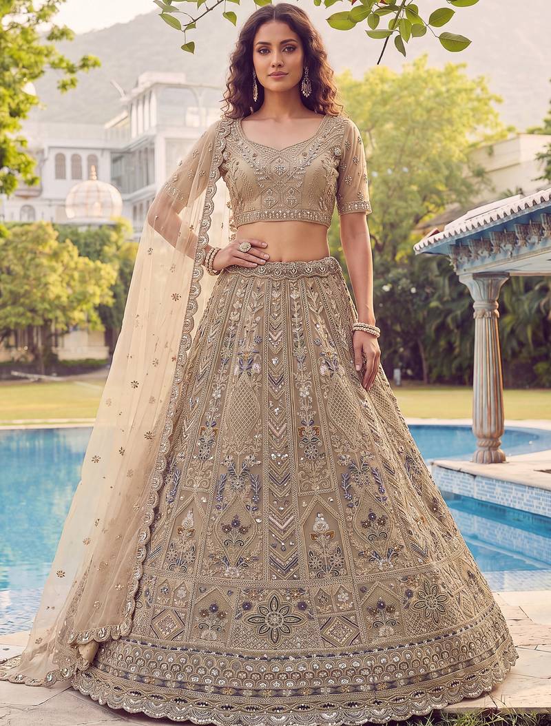 Shiny Beige Embroidered Net Reception Wear Lehenga Choli With Dupatta