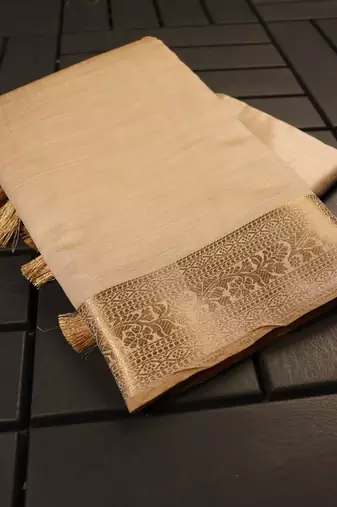 Cream color elegant tussar silk zari weaving saree with unstitched blouse
